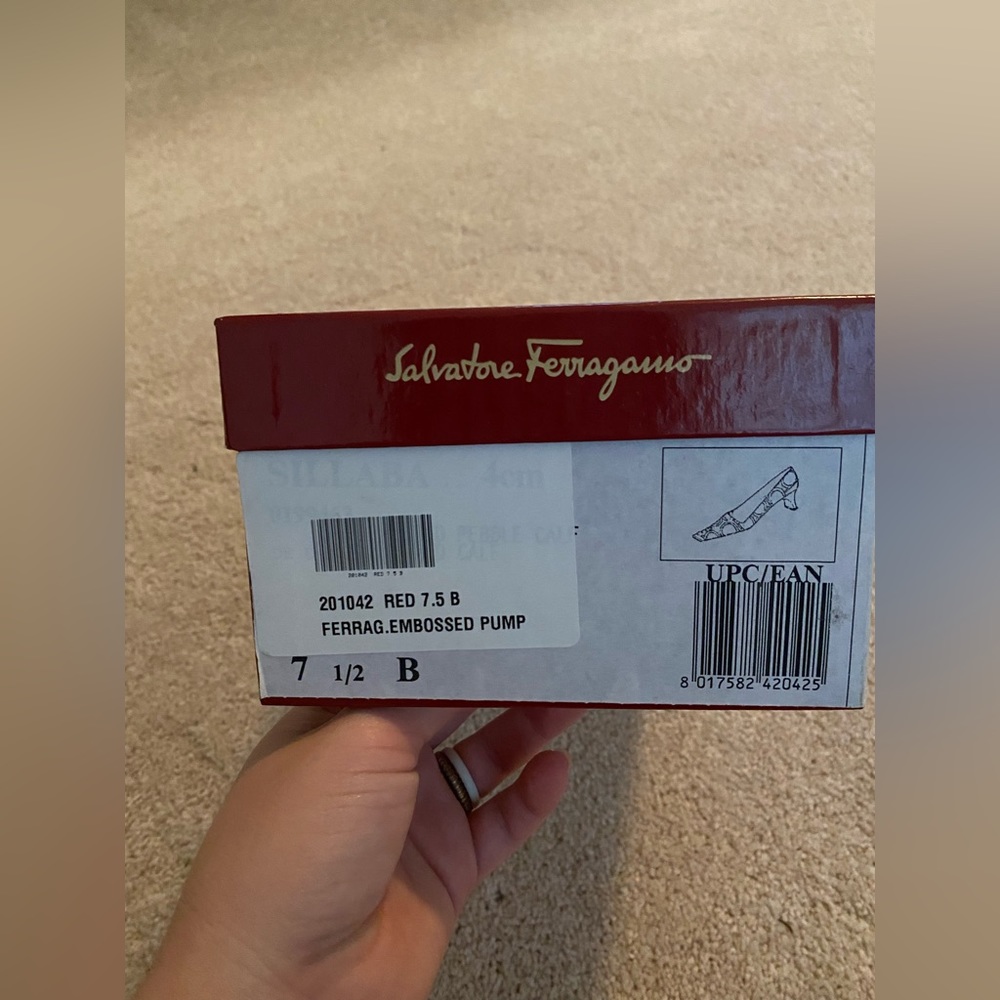 Size 7.5 Salvatore Ferragamo Heels. Red w/ Ferragamo logo all over. Gently worn.